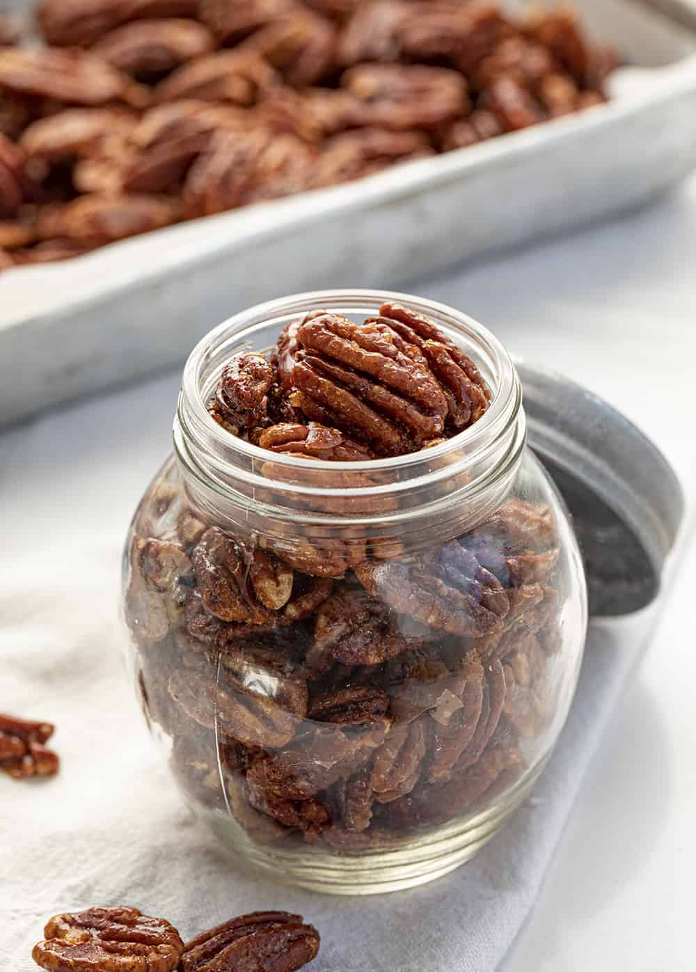 Candied Pecans are a sweet and crunchy treat that is easy to mix together and bake anytime you need to satisfy a sweet tooth! Candied Pecans, How to Make Shiney Candied Pecans, Perfect Candied Pecans, iambaker, i am baker, recipes, Christmas, baking, holidays, appetizer Candied Pecans in Jar